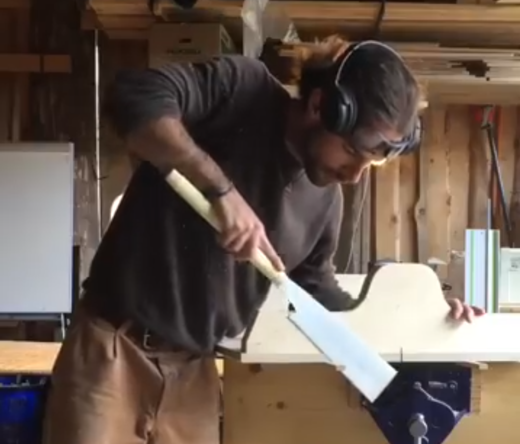Sawing with a Japanese pull saw in the garage