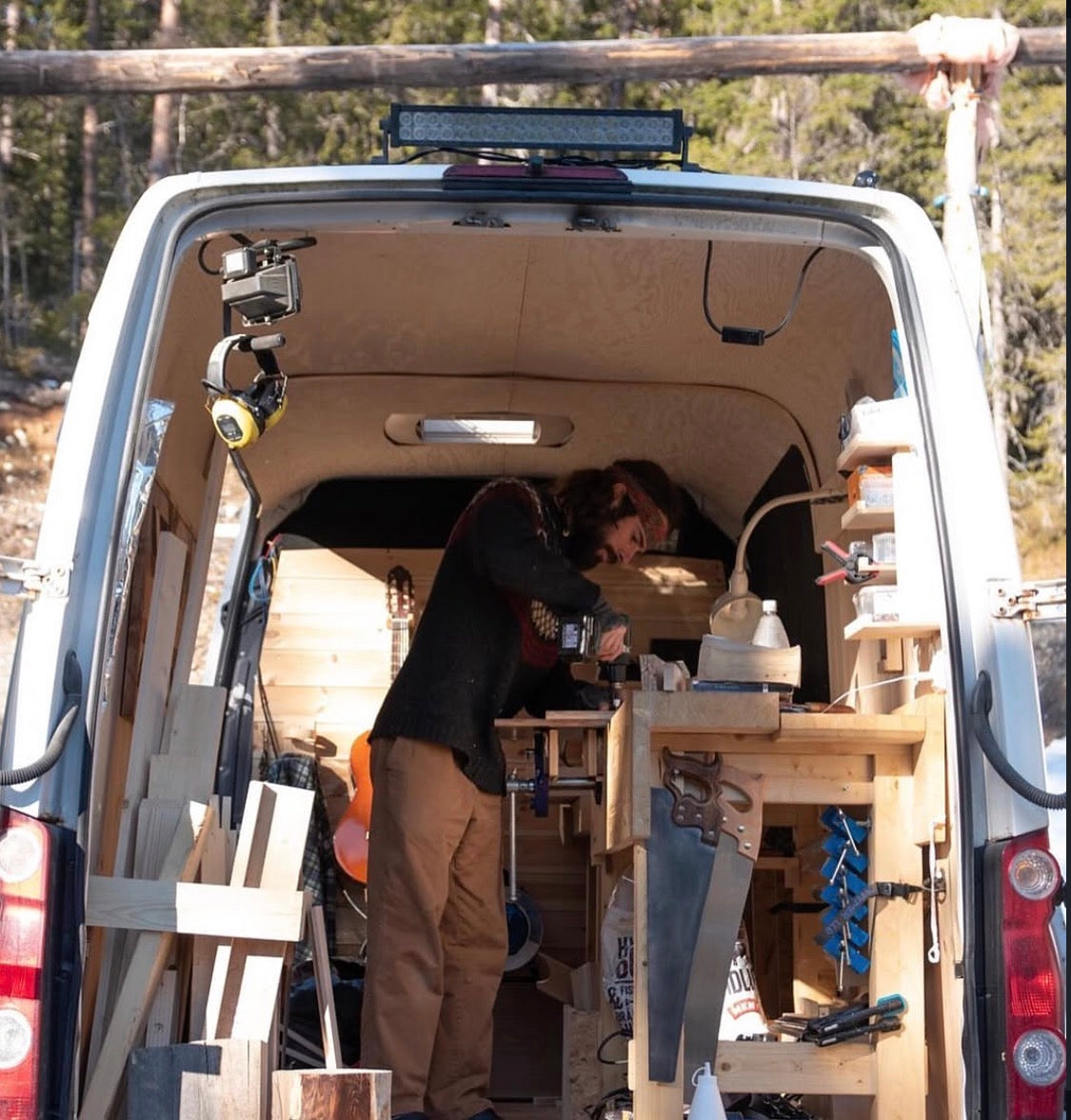 Zdenko at the workbench inside the van